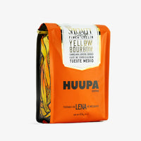 empaque naranja por enfrente café de especialidad yellow bourbon